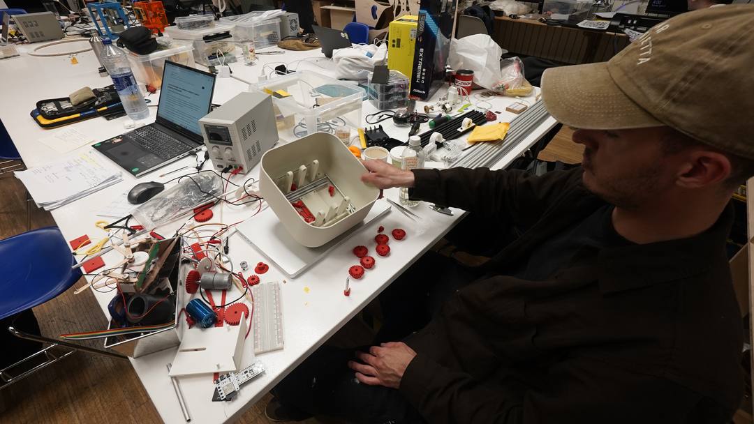 Gabriel assembling the creature at the lab bench