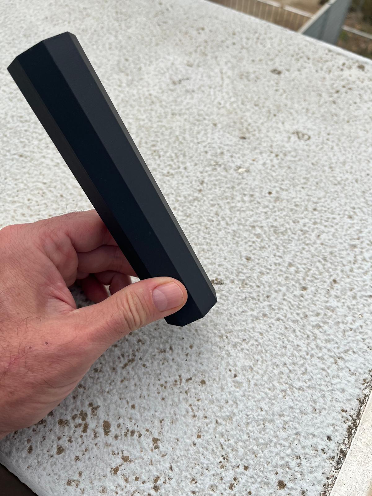 Side view of the printed handle showing the faceted outer geometry.