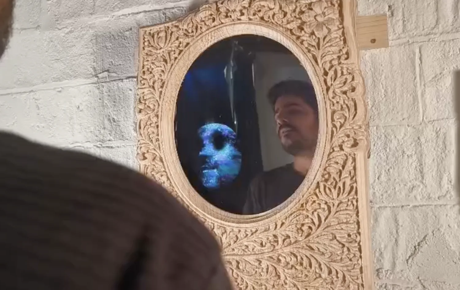 The face dissolved and redrawn as a glowing blue physarum growth network