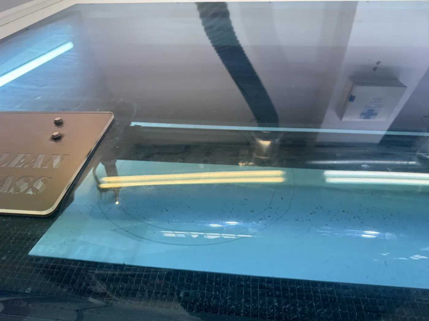 The MDF ring being cut on the laser cutter bed