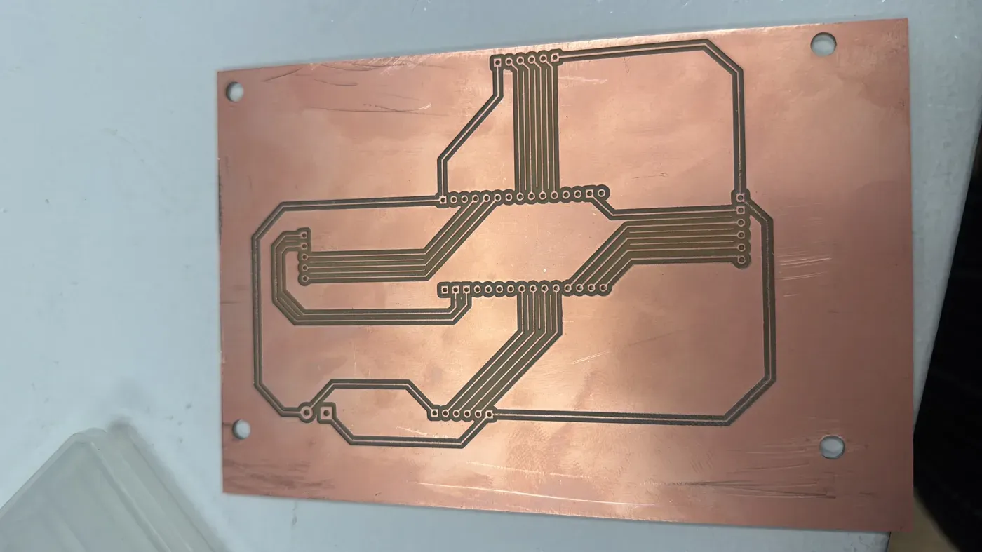 The finished milled copper shield board with isolation traces for three motor headers and the joystick