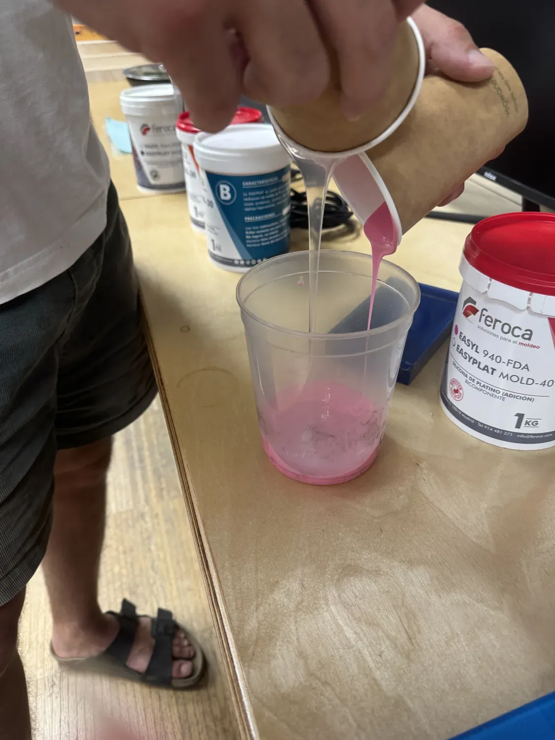 Mixing the pink two-part EasyPlat silicone in a cup