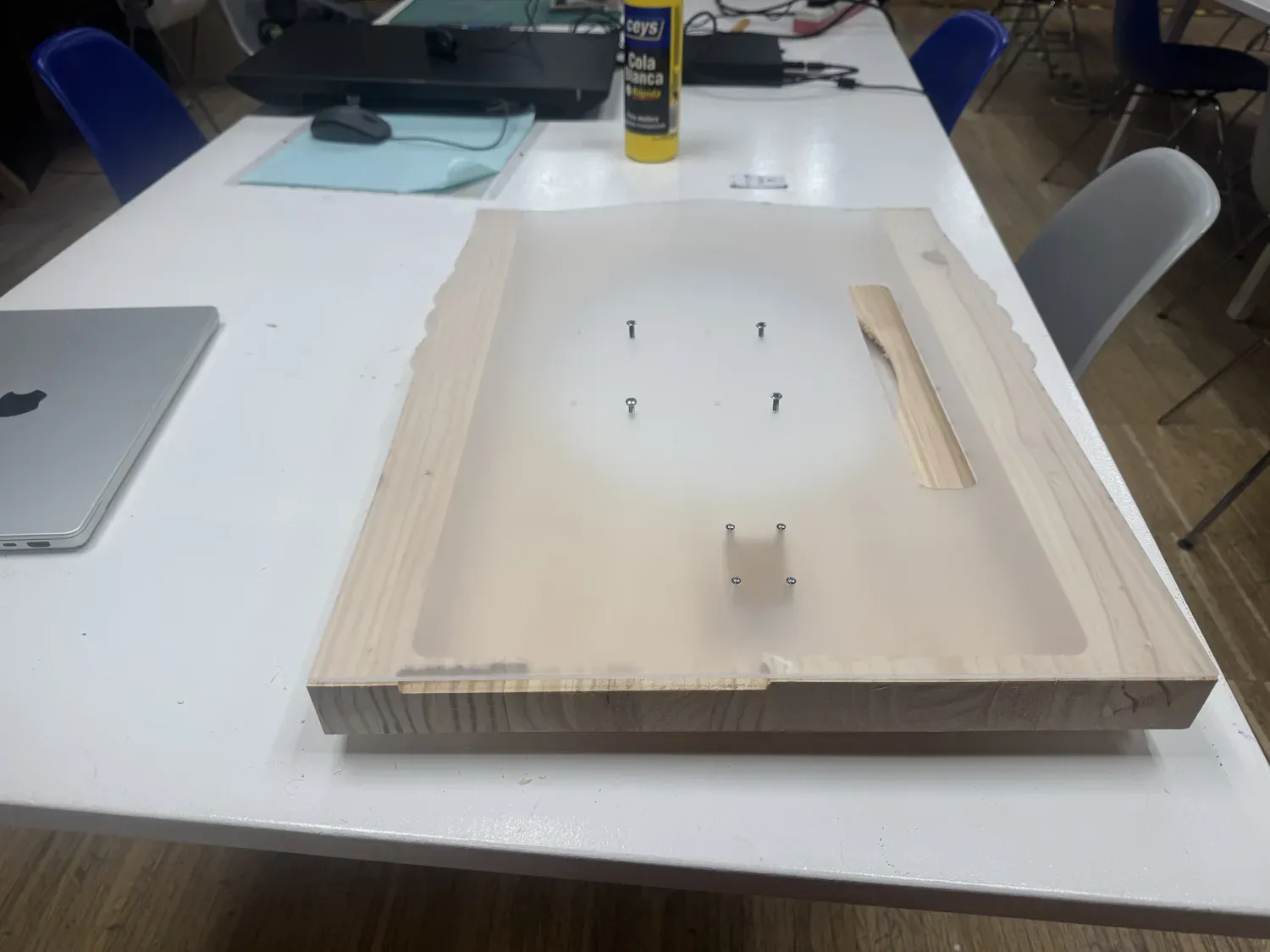 The acrylic panel offered up to the wooden frame to check fit