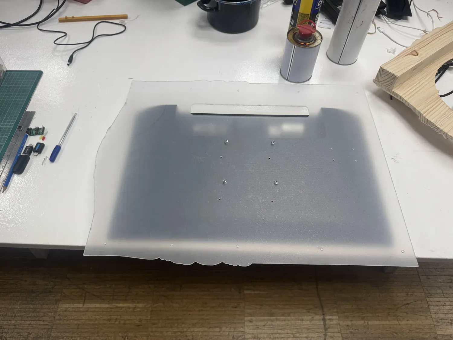 The frosted laser-cut acrylic back panel with screw holes