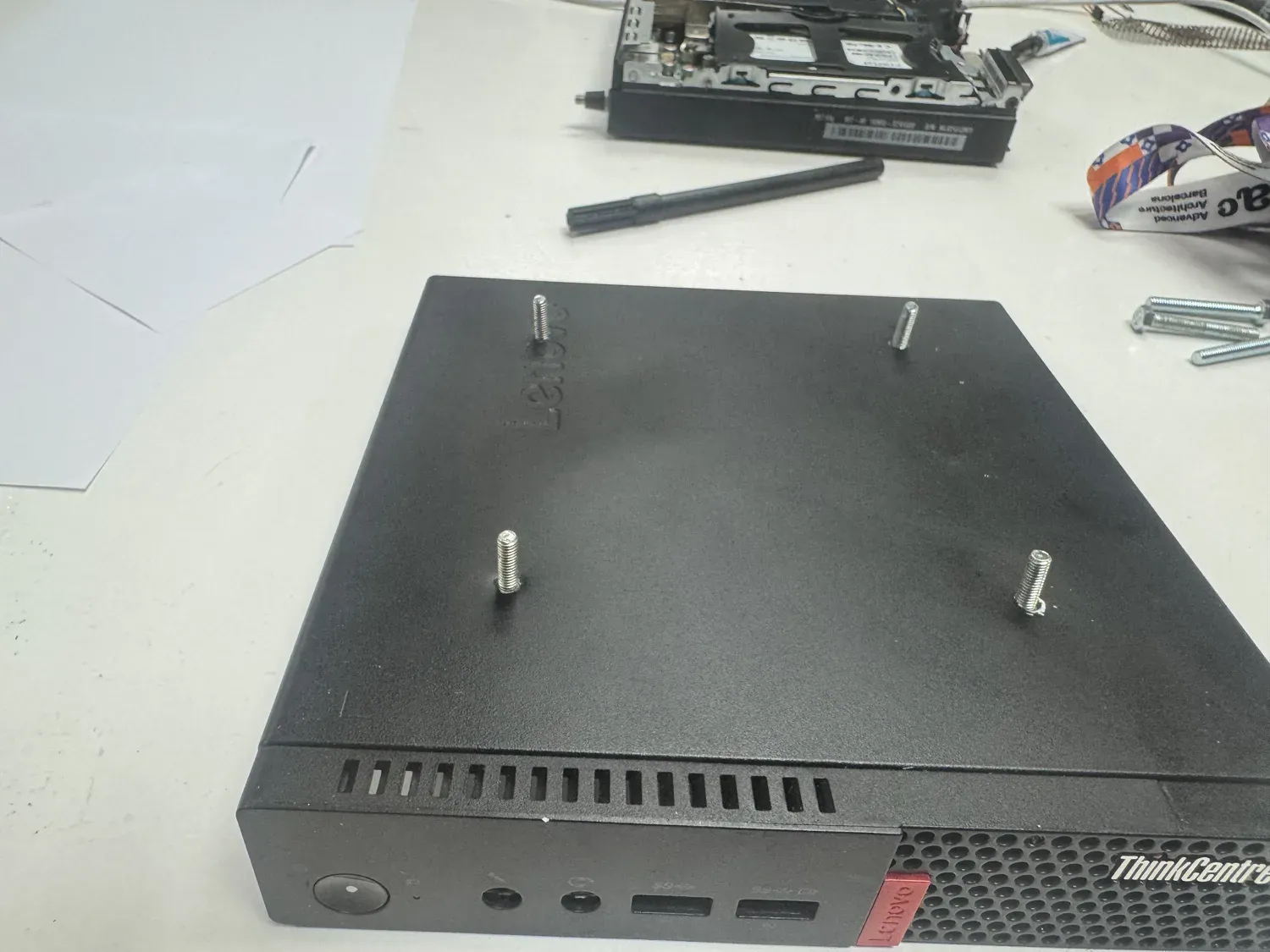 The mini PC with standoff screws fitted for mounting