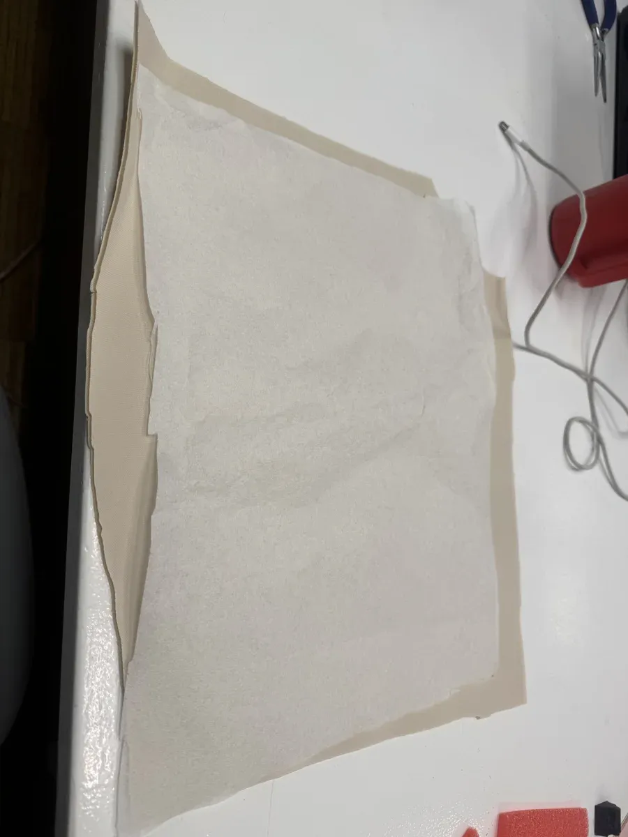 Thick spongy fabric with embroidery stabilizer backing