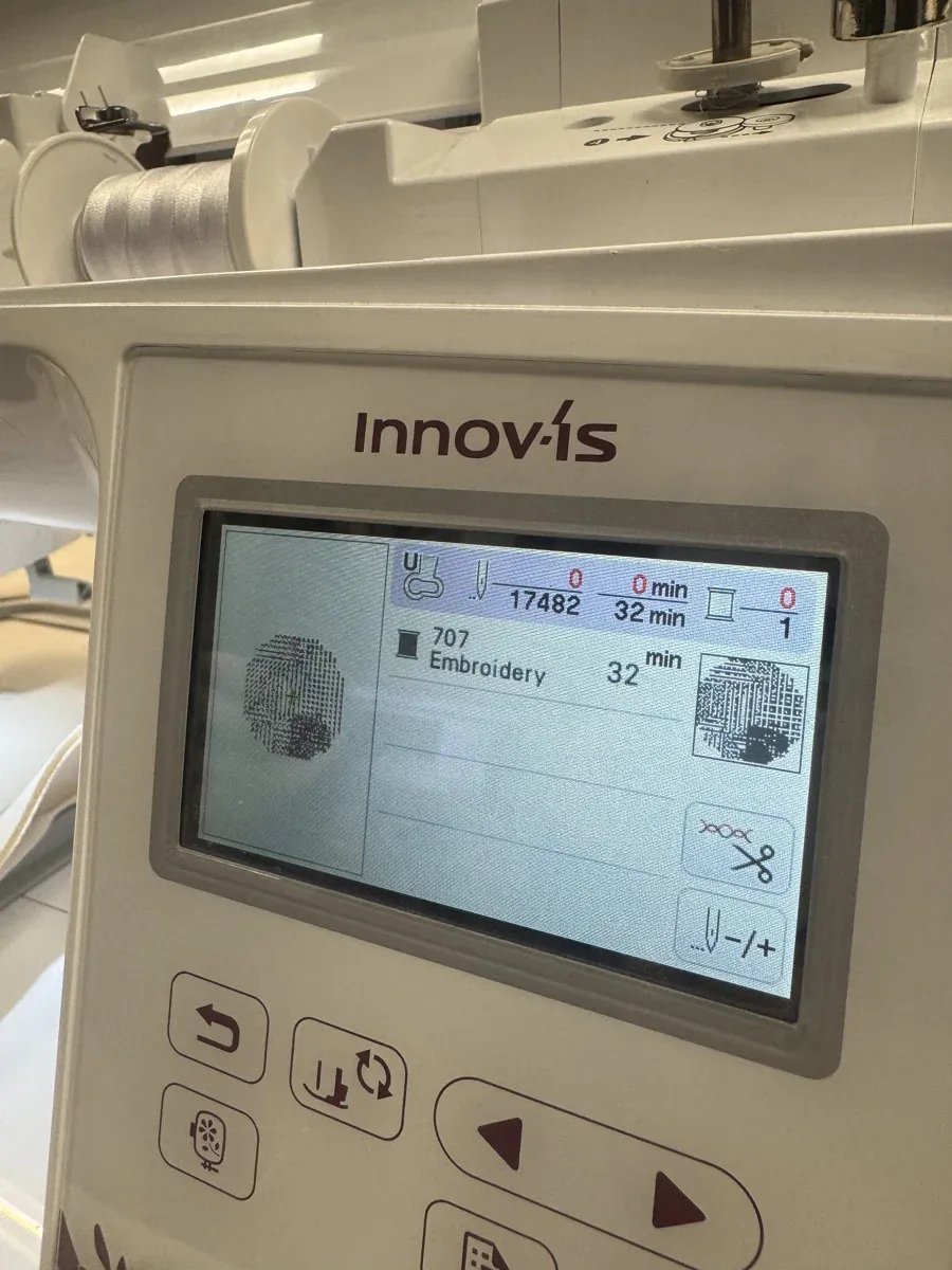Machine display showing 17482 stitches, 32 minutes estimated time