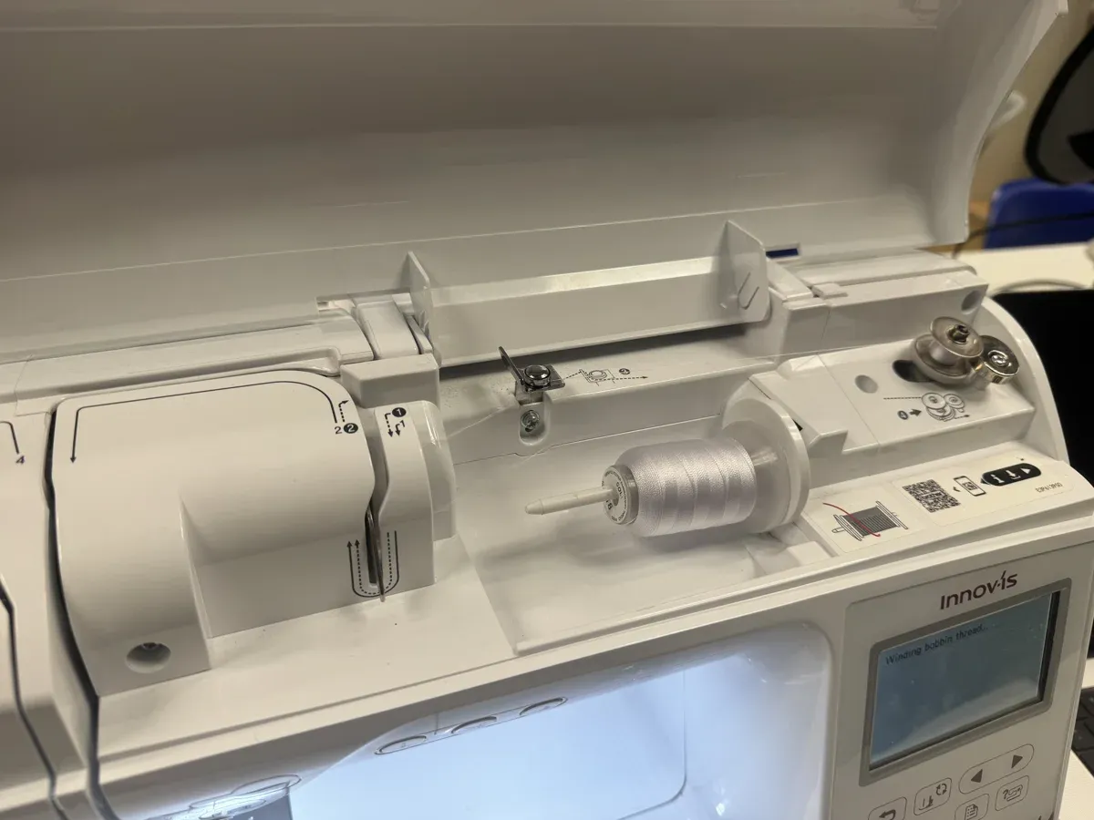Machine display showing winding bobbin thread