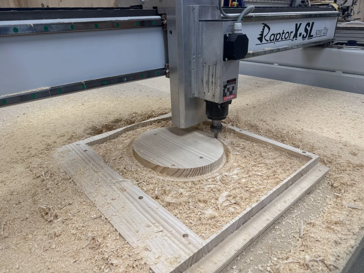 Pine frame being CNC-carved on the Raptor X-SL router, oval pocket being cut