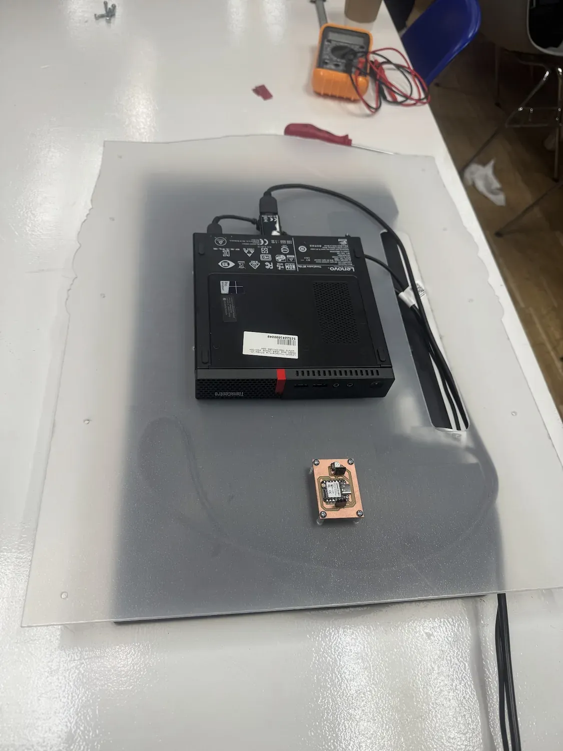 Mini PC and the custom XIAO PCB positioned on the rear acrylic panel of the assembly