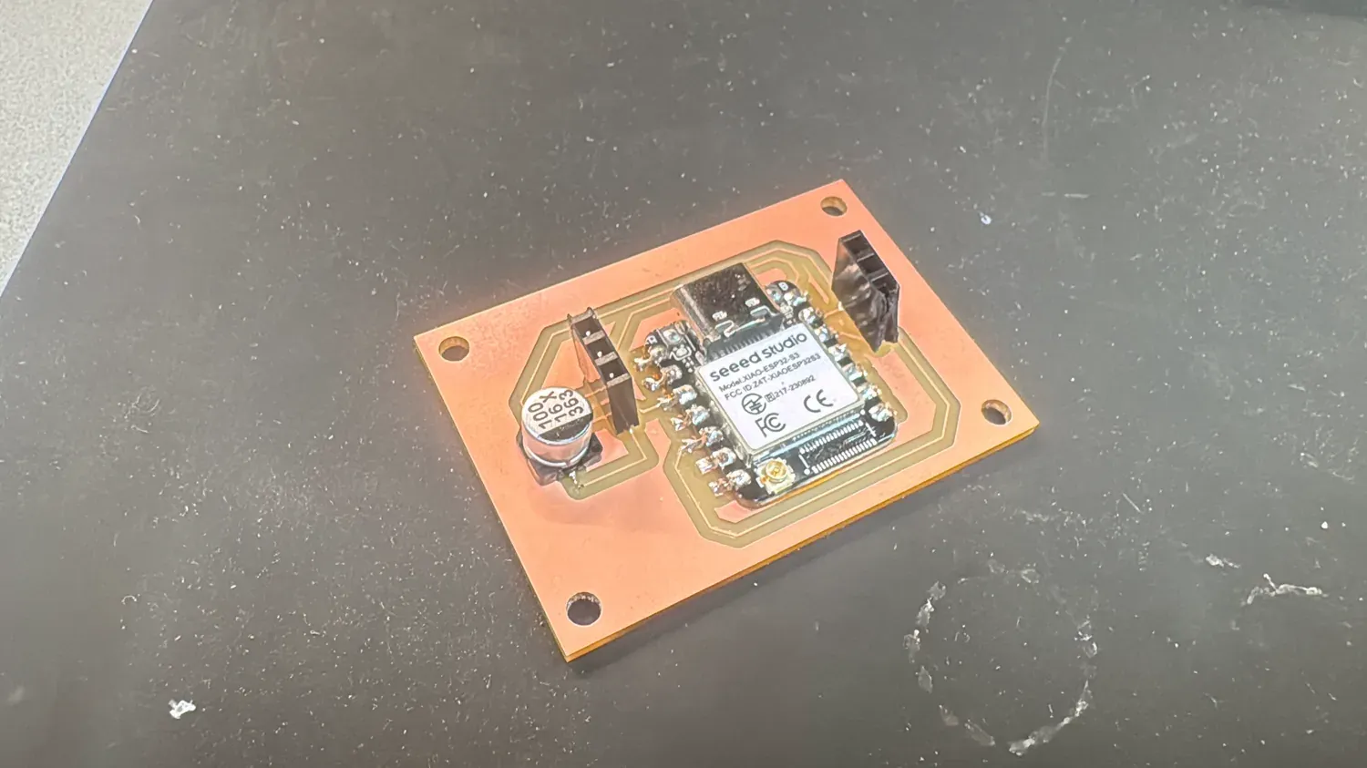 The milled XIAO ESP32-S3 PCB on single-sided copper with cap and pin headers