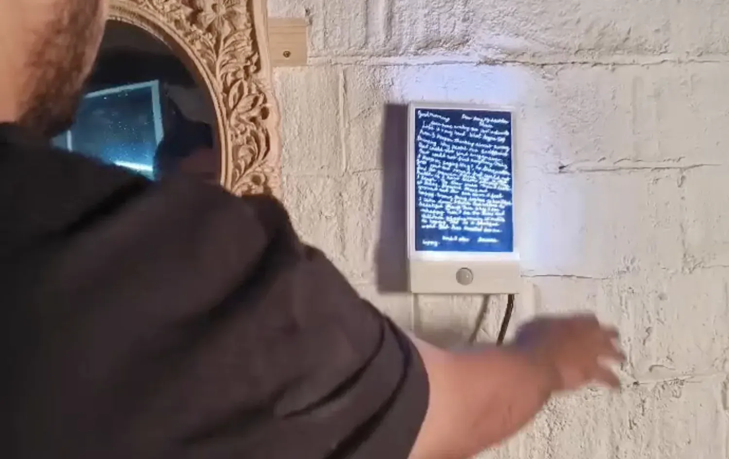 A viewer triggering the PIR sensor on the lit letter holder while the experience runs