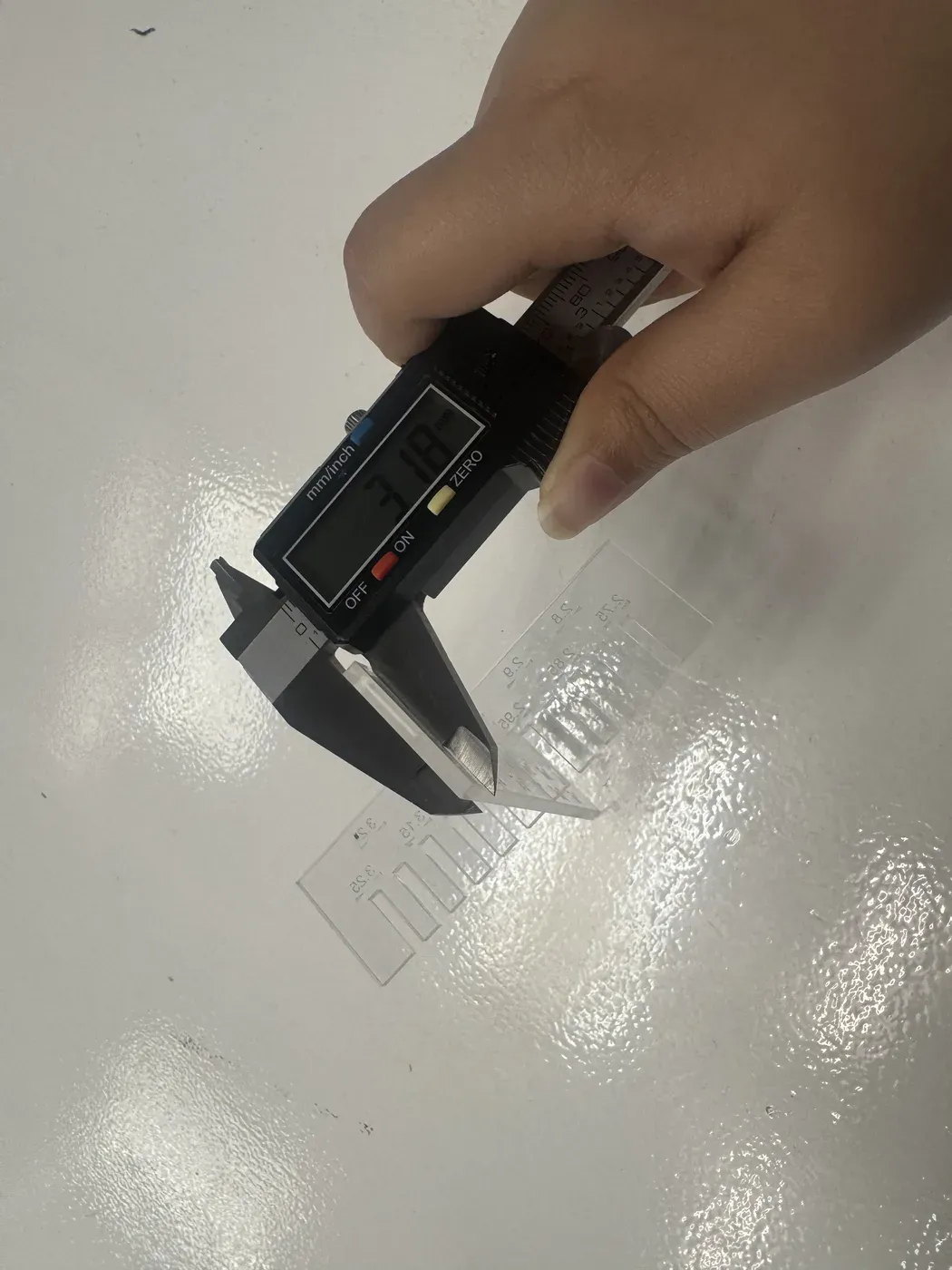 Calipers showing 3.18mm