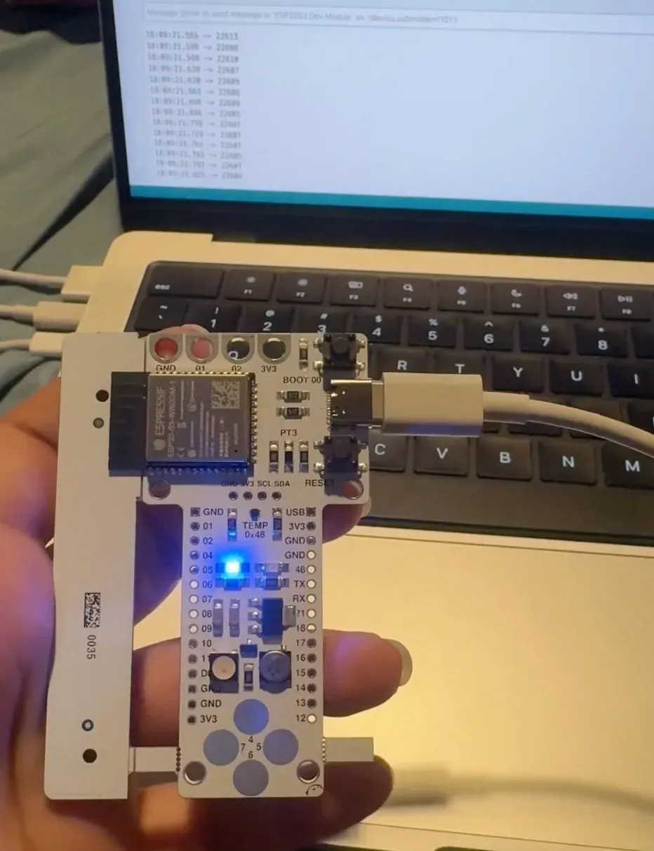 Barduino with blue LED lit, serial monitor showing touch sensor values