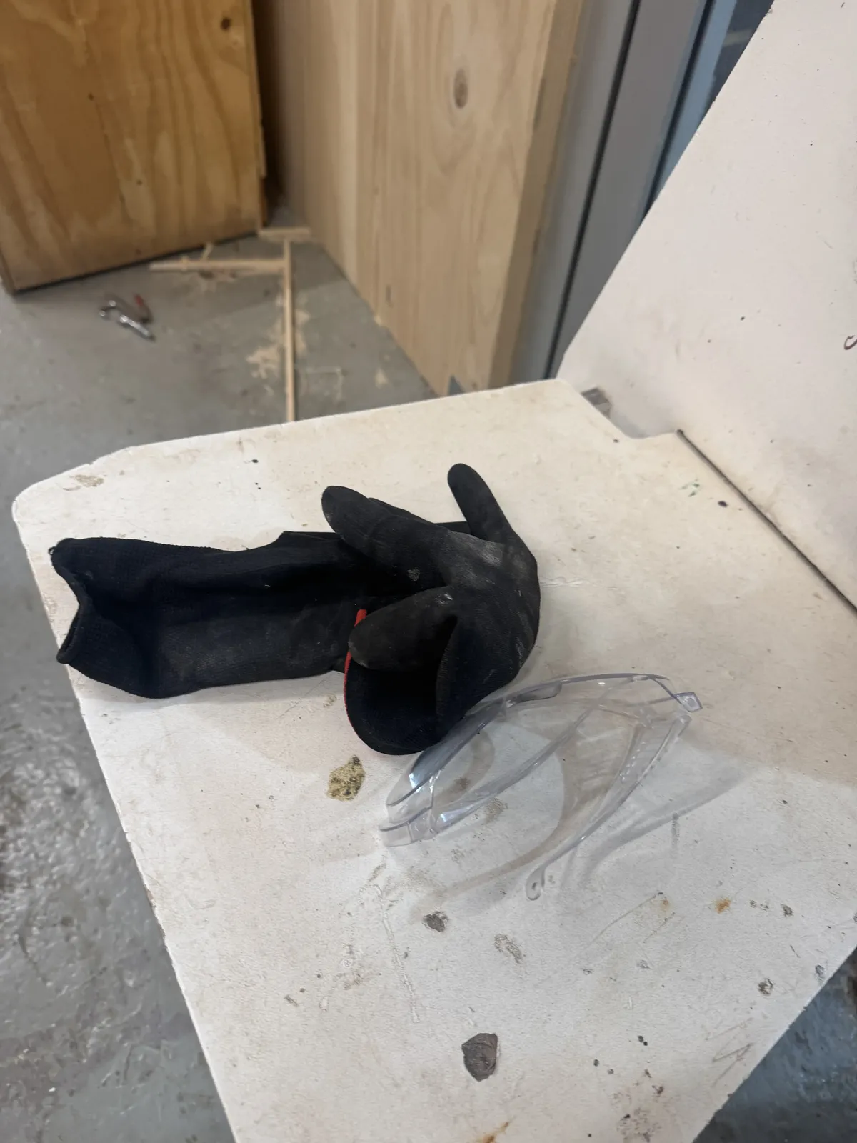 Gloves and safety glasses laid out before the cut