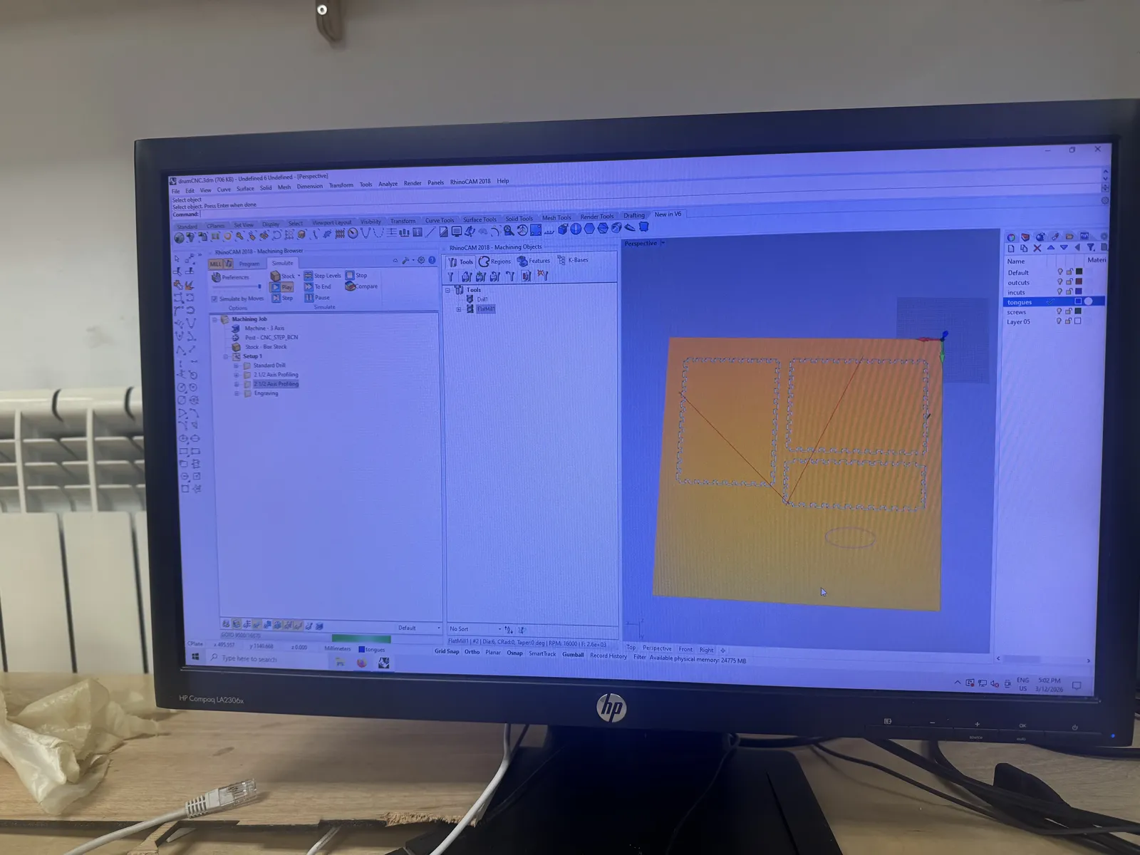 RhinoCAM simulation showing parallel finishing toolpath over the stock