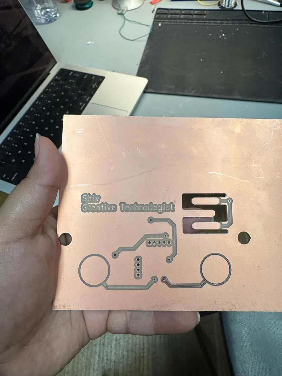 Freshly milled PCB business card front face