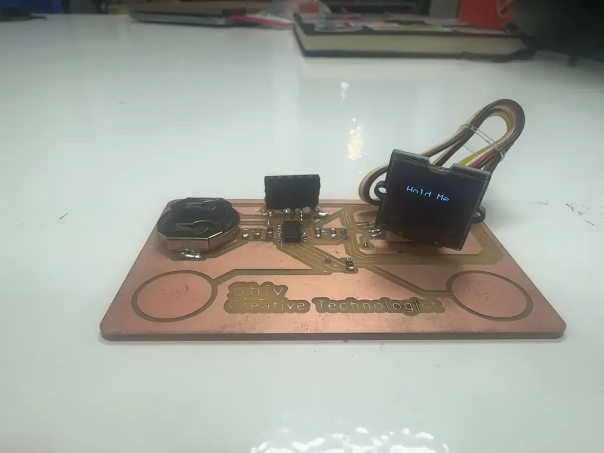 PCB business card with OLED connected via JST header