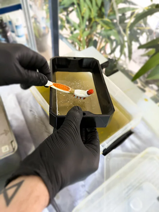 SLA parts being washed after printing