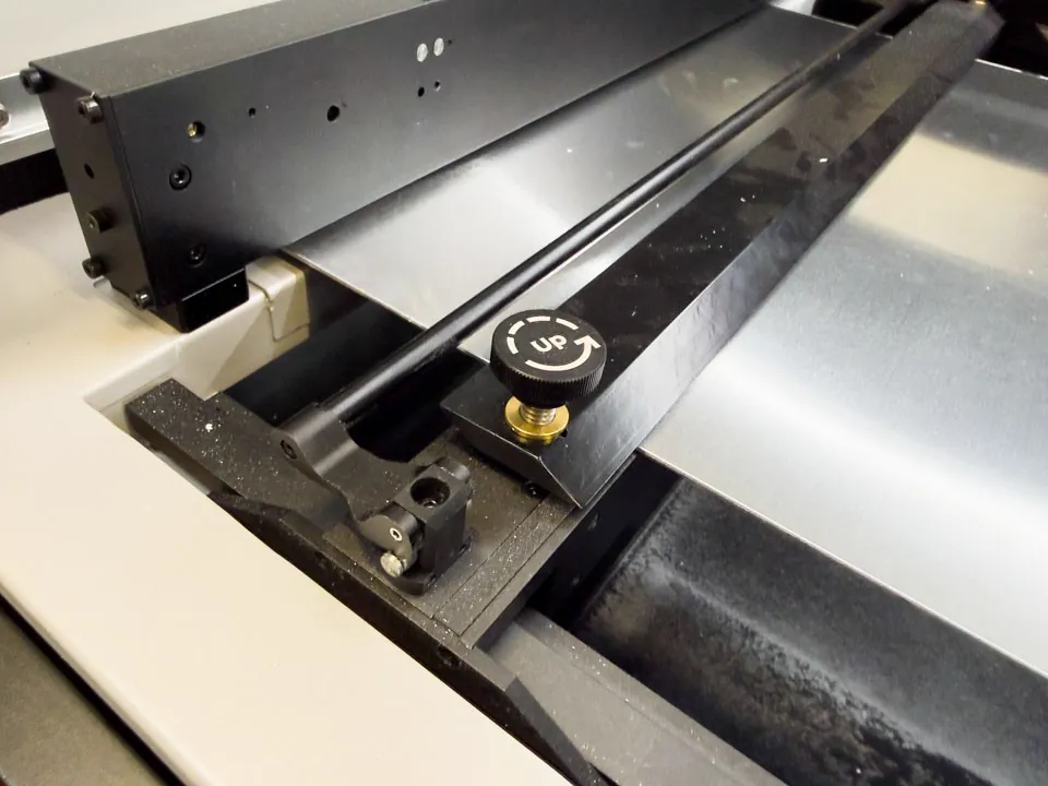 Aluminum sheet fixed with the machine rails inside the xTool MetalFab CNC cutter