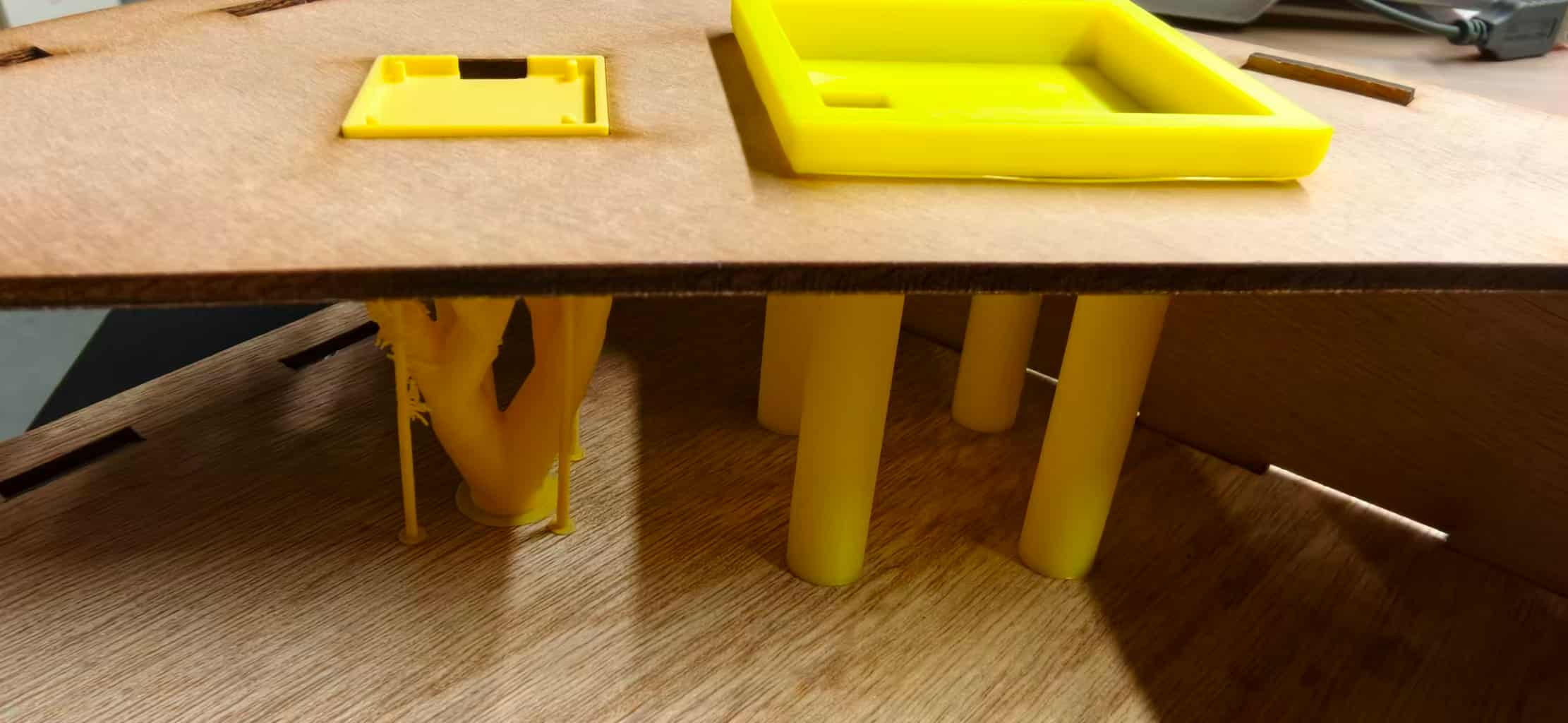 Underside view: stepped frames seated in the panel and pillars extending downward