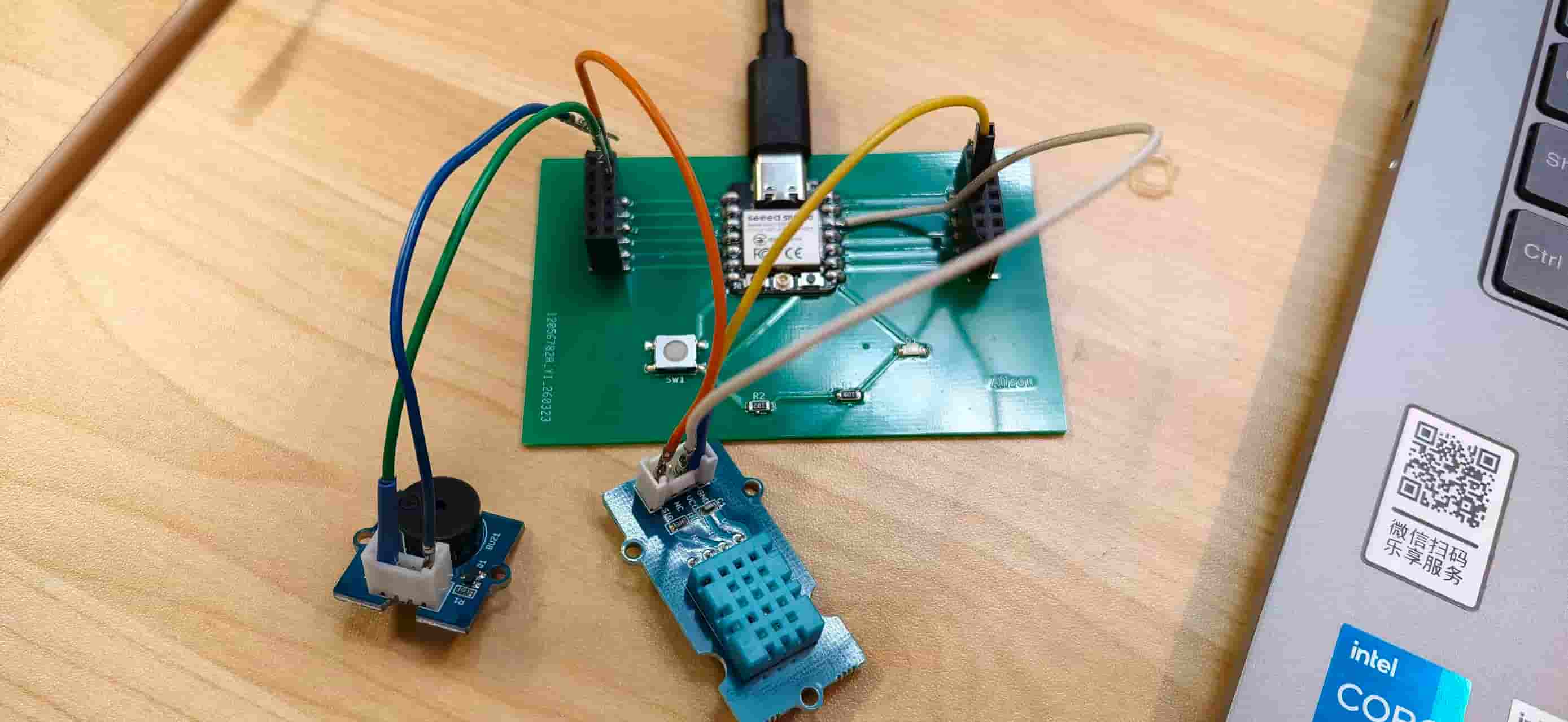 Custom PCB with DHT11, buzzer, and jumpers during bring-up