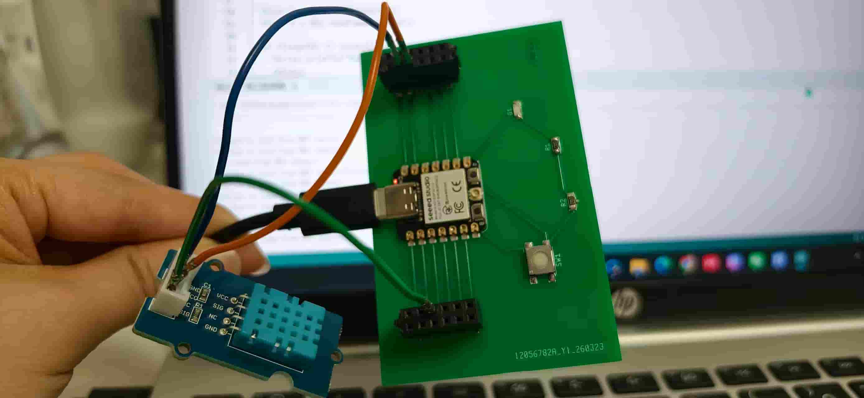 Testing the Week 8 board with the DHT11 and a laptop nearby