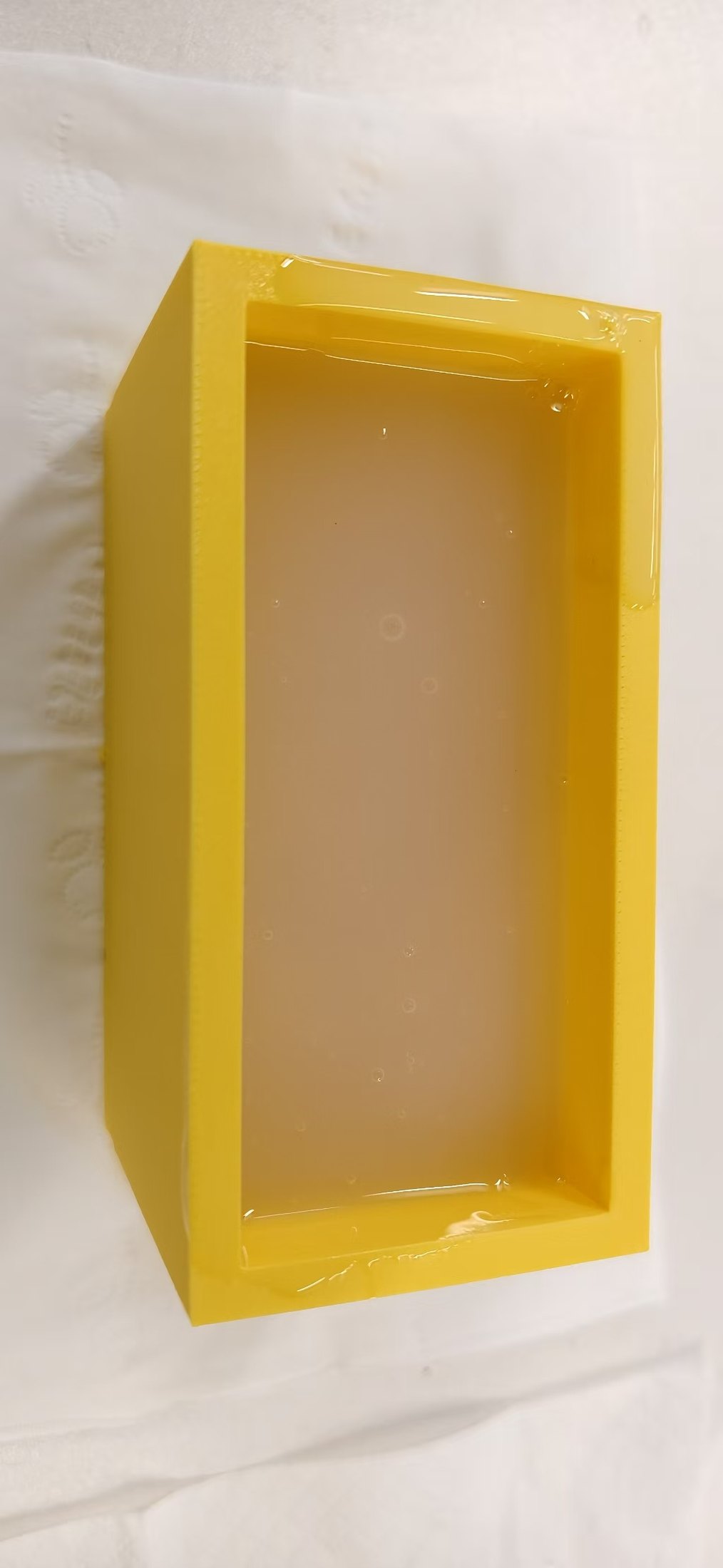 The cloud cavity after the mistake: uncatalyzed pour material—not a cured, demoldable rubber mold