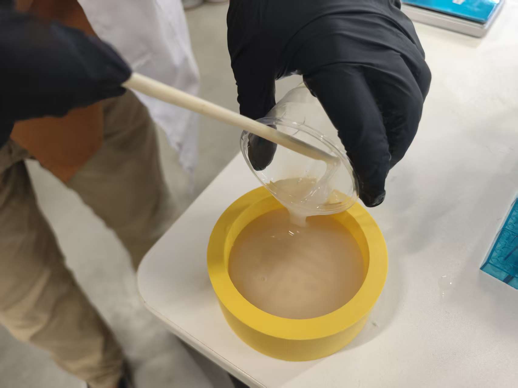 Pouring catalyzed silicone into the circular Fu positive