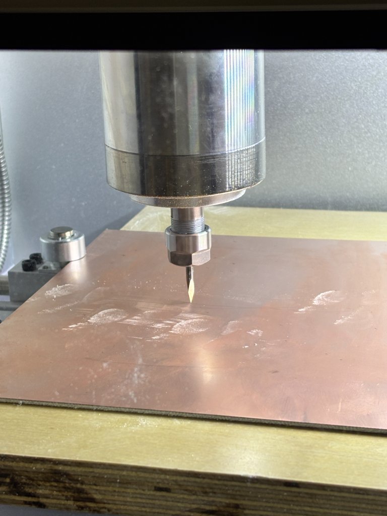 Copper plate fixtured on machine bed