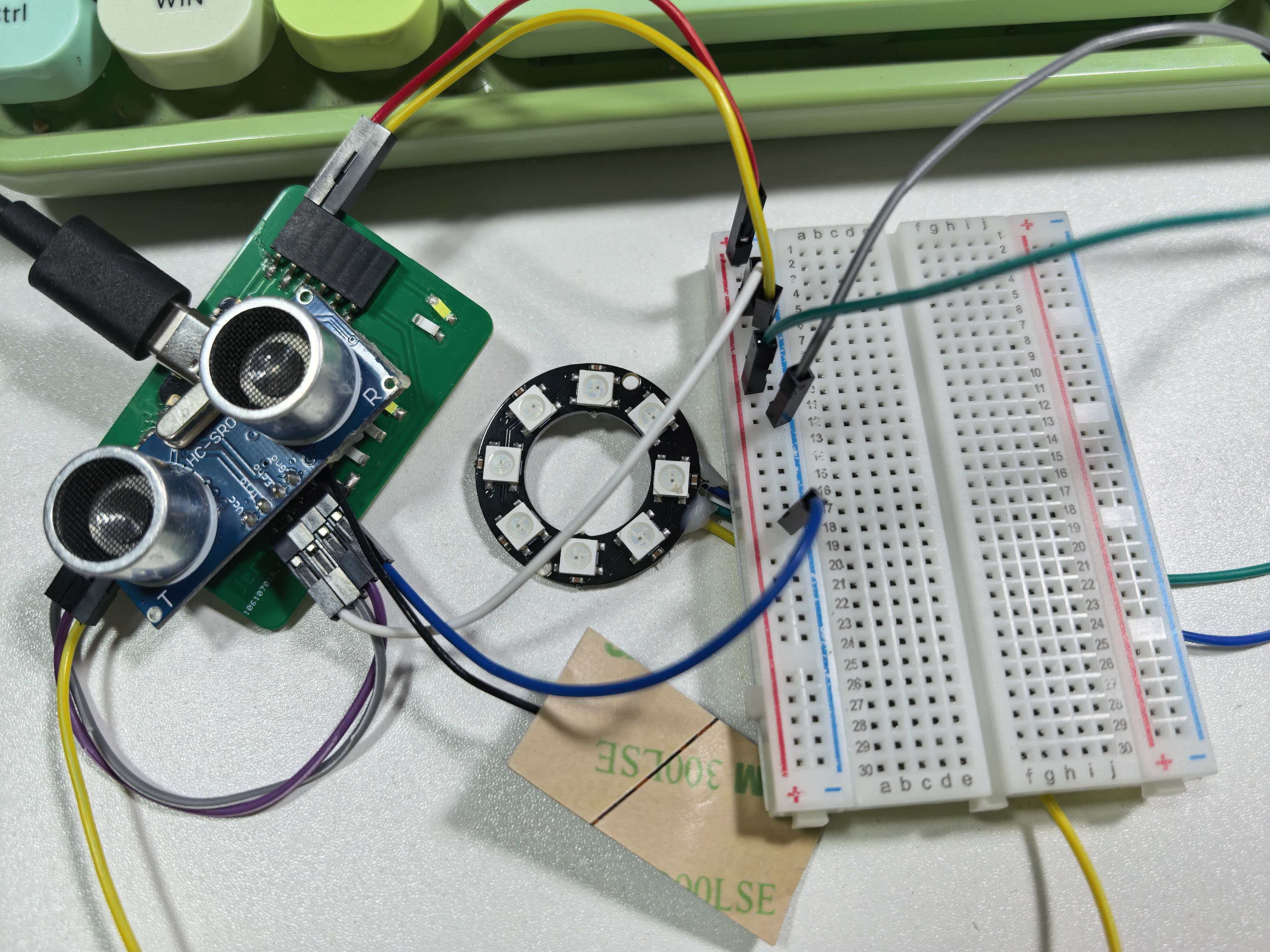 HC-SR04 and 8-LED NeoPixel strip wired to XIAO ESP32-C3 board