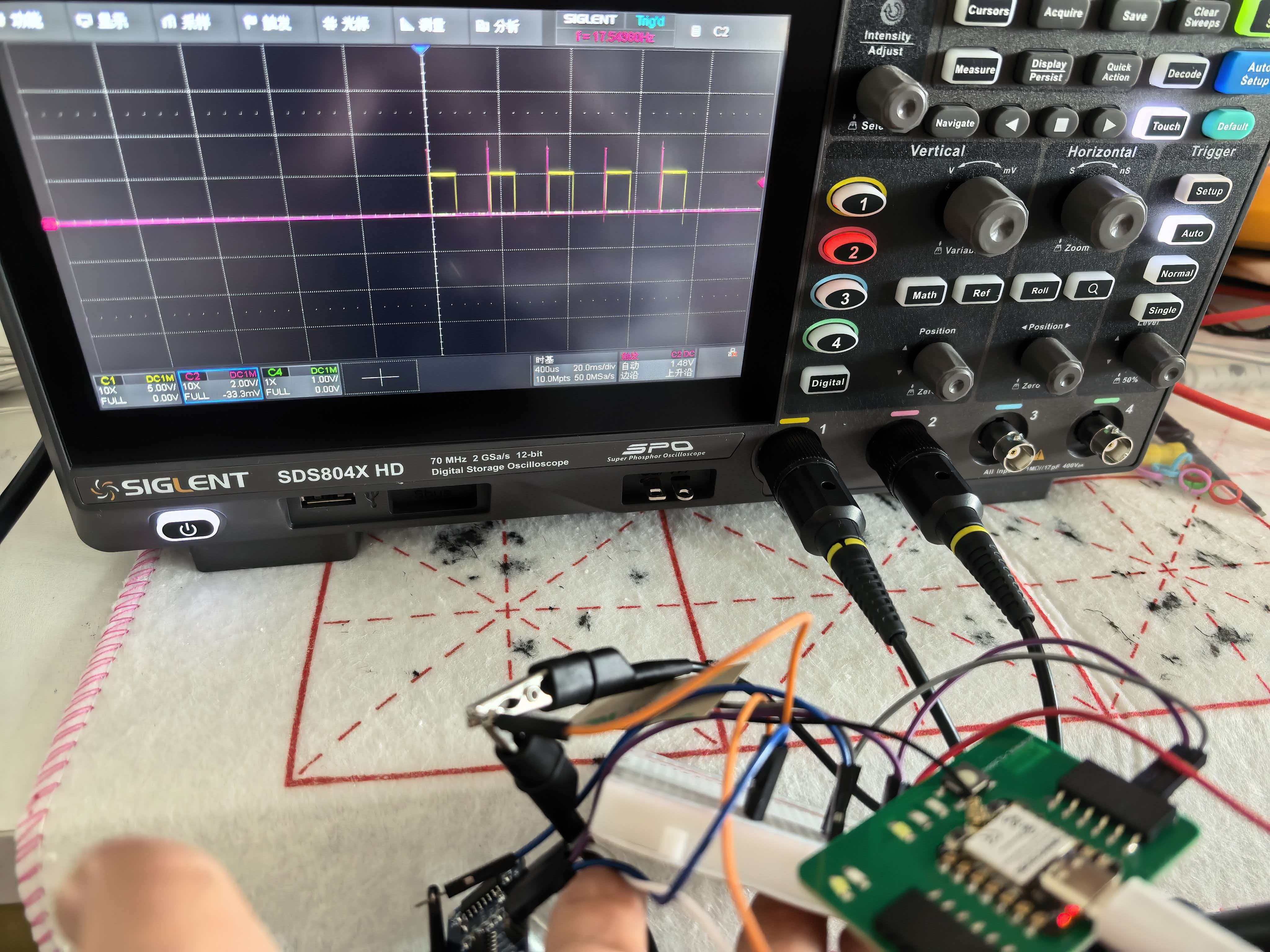 Oscilloscope capture of HC-SR04 Trig pulse on CH1 and Echo pulse width on CH2