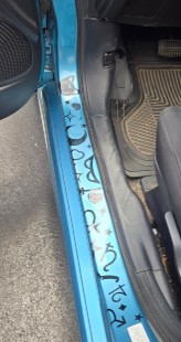 Sailor Moon themed vinyl stickers on the inside of my car door