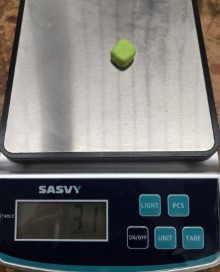 The play dough from the mold on a scale