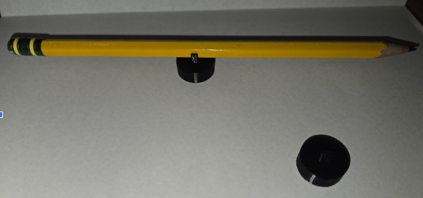 Claw hand holding a Pencil