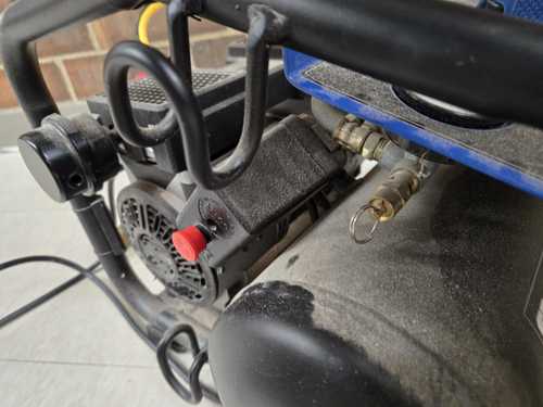 Red power button on the Blue Kobalt compressor