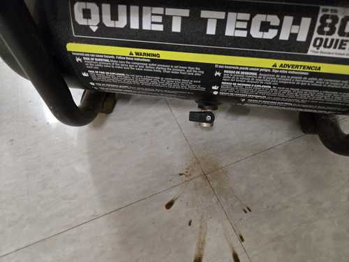 Rust-stained floor showing what happens when a compressor is not drained regularly