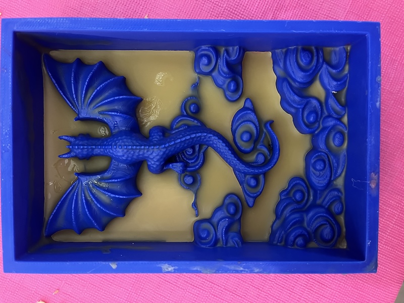 wax coating on dragon in clouds