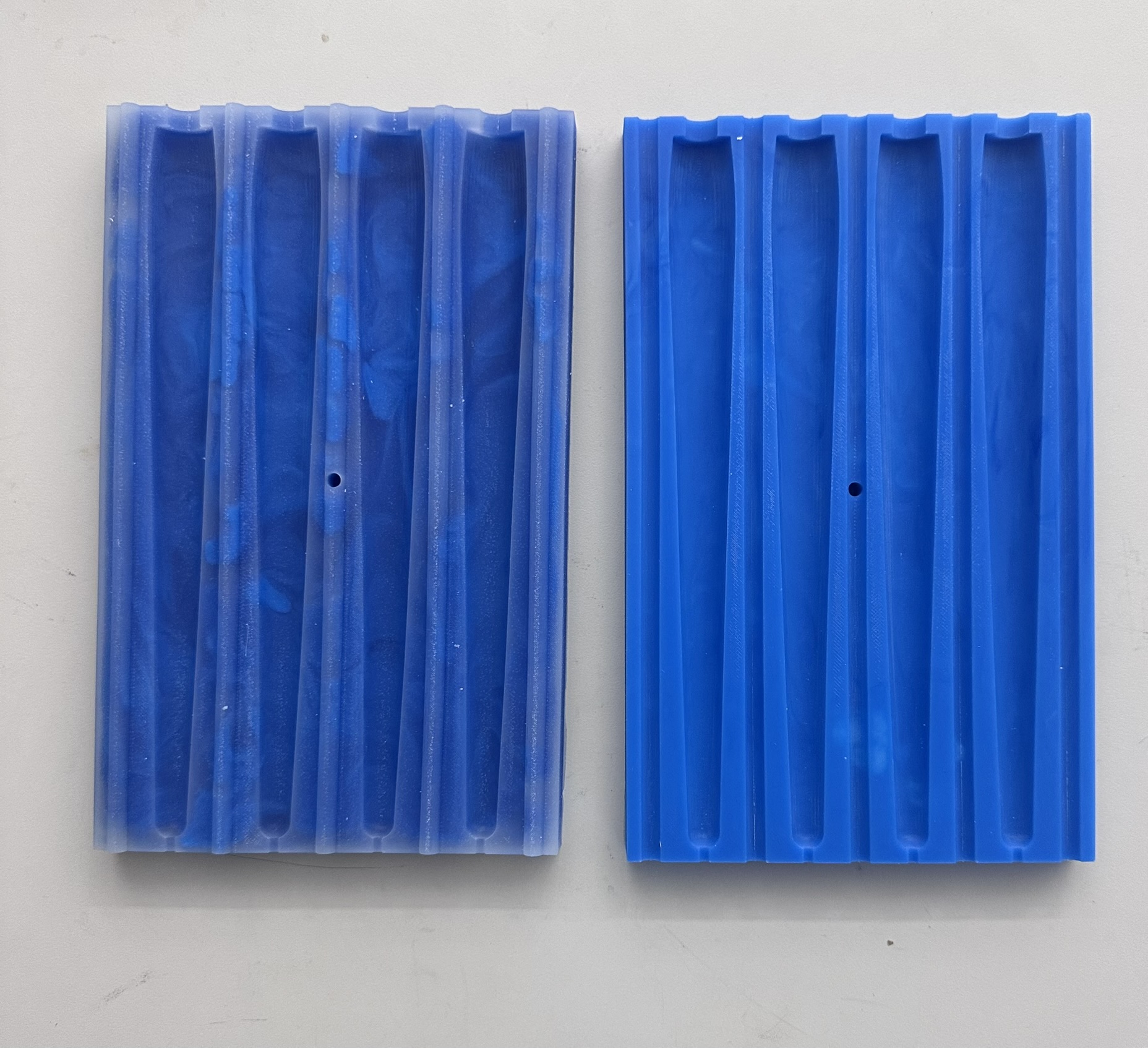 Two silicone mold halves with different textures from different batches