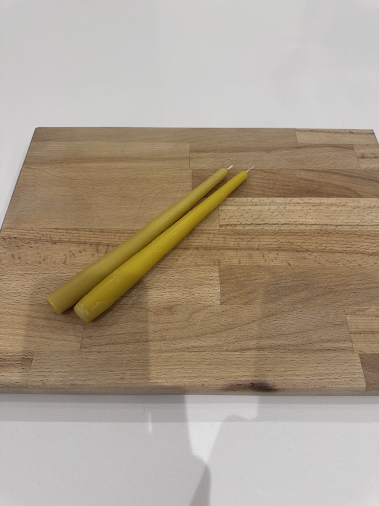 Finished beeswax candles cast from silicone molds