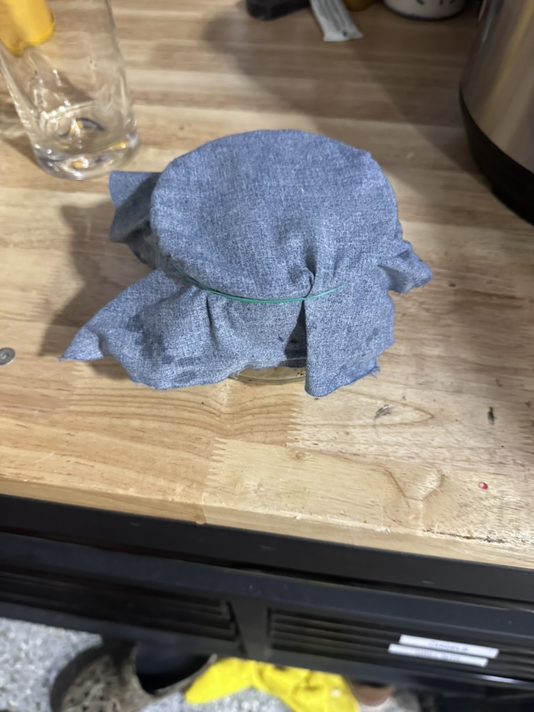 Glass jar with rag filter on top