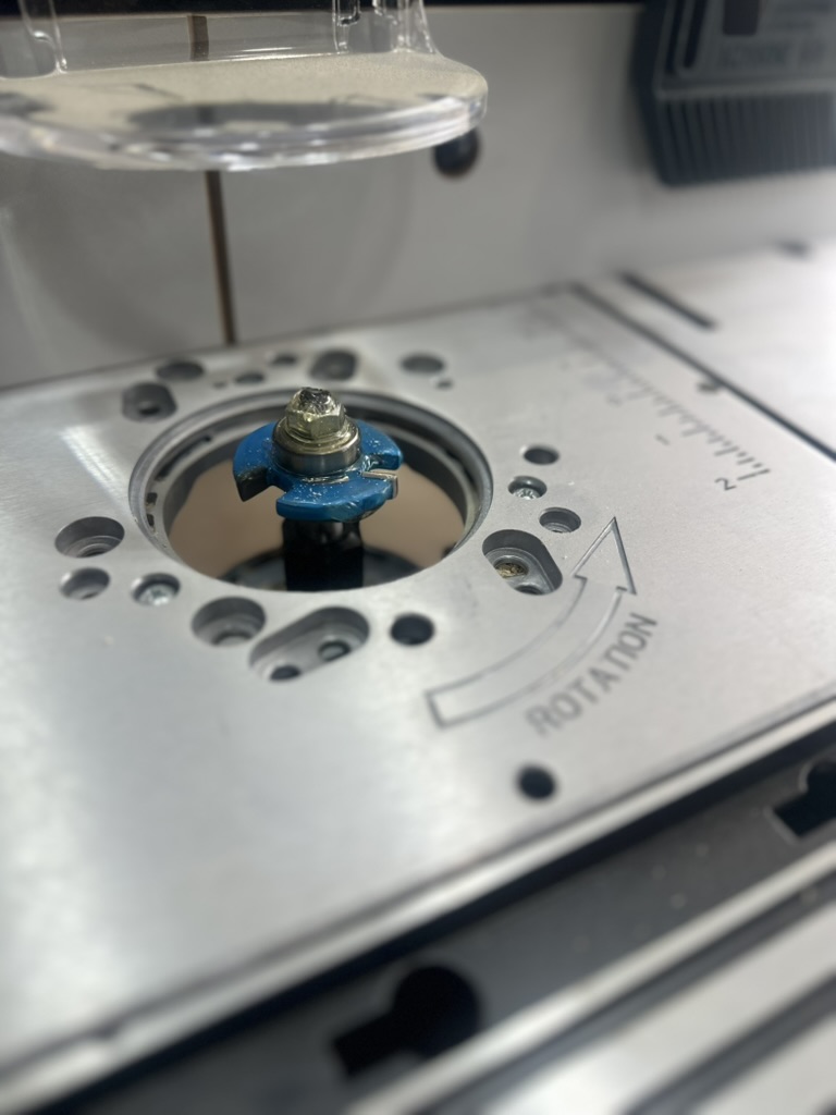 Router bit attached to router table