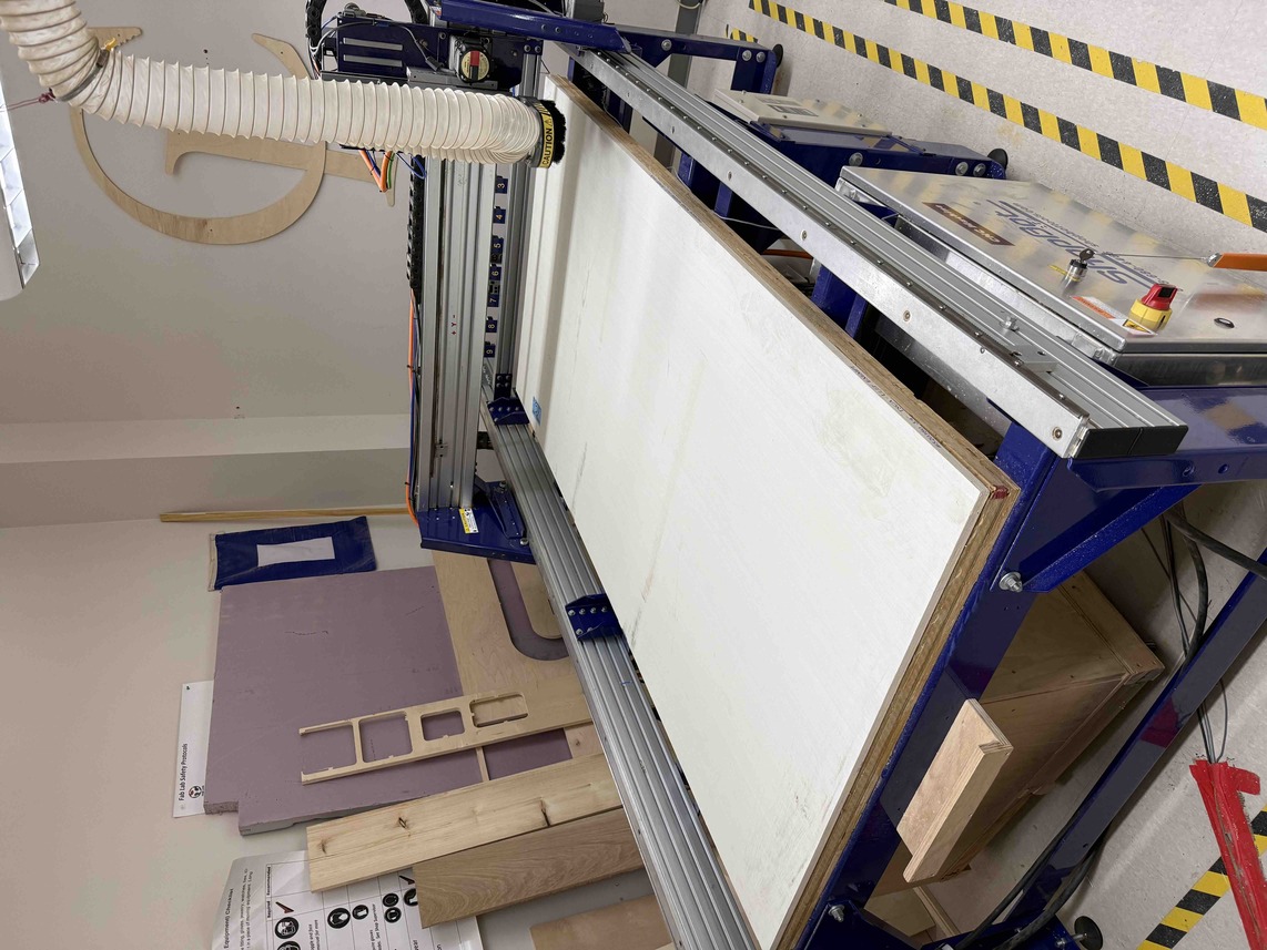 Wood Board Nailed to ShopBot Bed