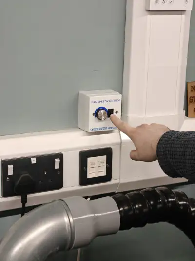 Fan speed control dial on the wall