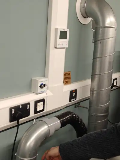 Shared exhaust system between cutters