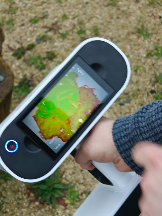 While scanning, green patches show captured areas and red patches show areas that need more scanning