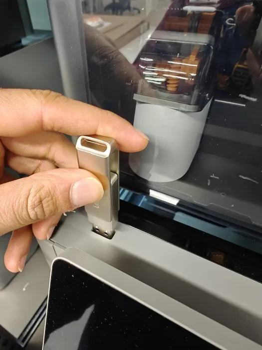 I plugged the USB into the printer. Normally we can do this via the network as well, however my computer was not attached to this printer, so we thought this was easier