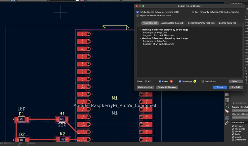 DRC clean - only silkscreen clipped by board edge warnings, 0 errors