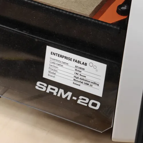 Enterprise FabLab inventory label on the SRM-20 showing model info and location