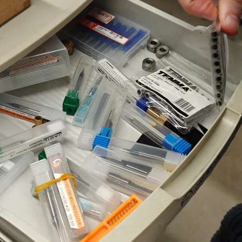 Drawer of assorted end mill bits and PCB milling tools